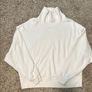 ALO Yoga White Turtleneck Sweater with Ribbed Detailing